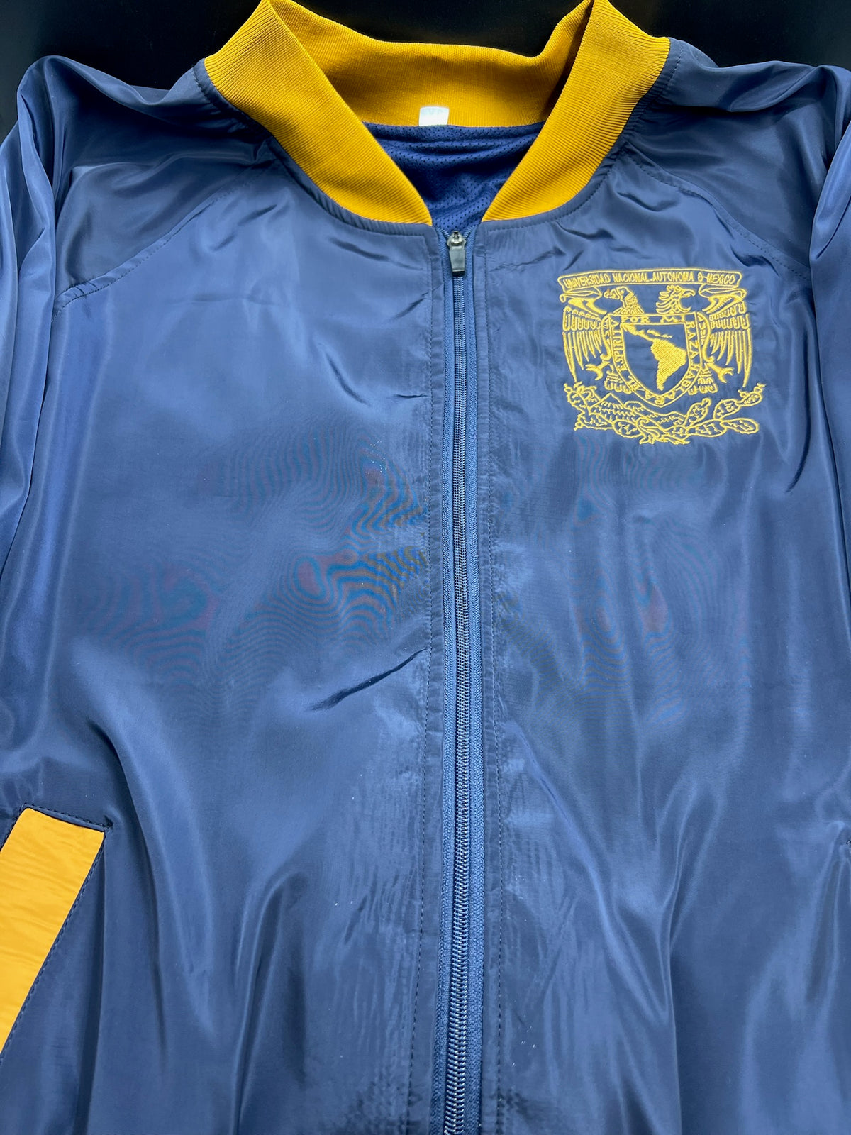 UNAM RAGLAN TIPO ROMPEVIENTOS
