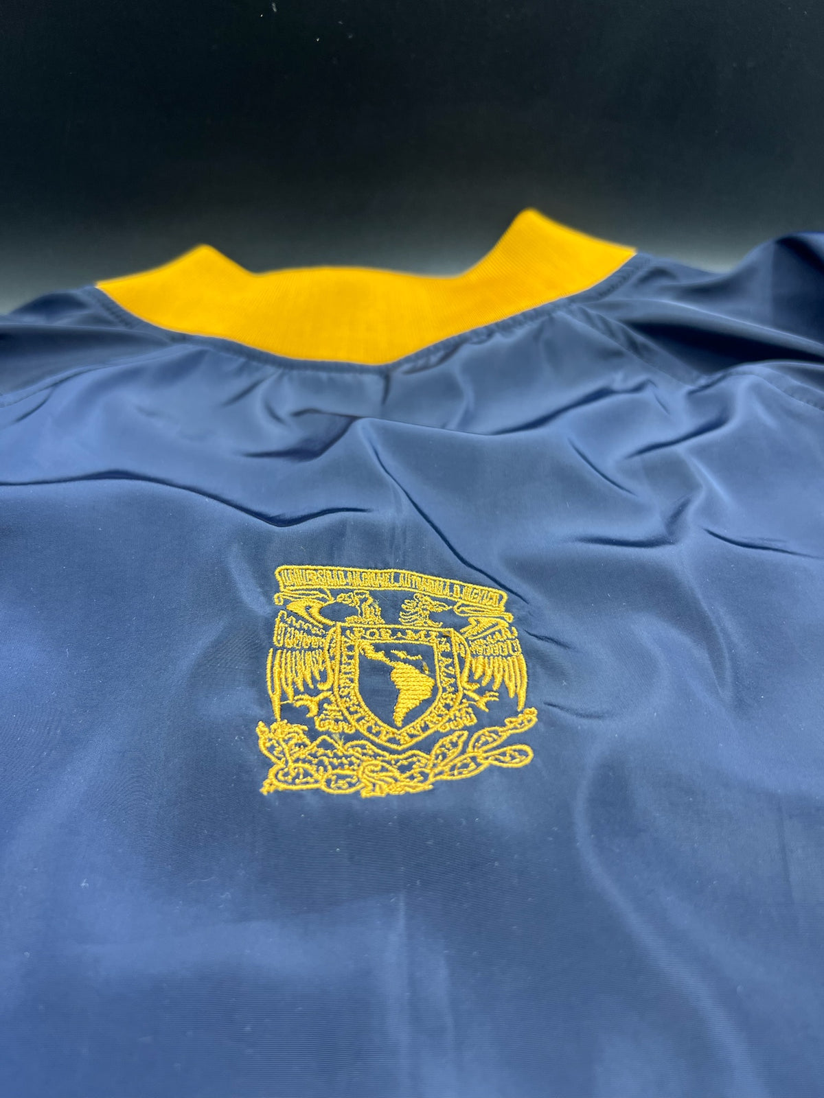 UNAM RAGLAN TIPO ROMPEVIENTOS